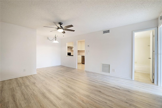 unfurnished living room featuring ceiling fan, light hardwood / wood-style floors, and a textured ceiling