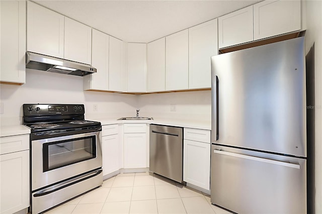 kitchen featuring white cabinetry, stainless steel appliances, sink, and light tile patterned floors