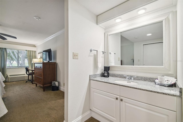 bathroom featuring ceiling fan, vanity, and ornamental molding