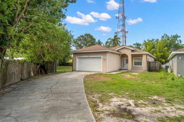 view of front of property featuring a garage and a front lawn