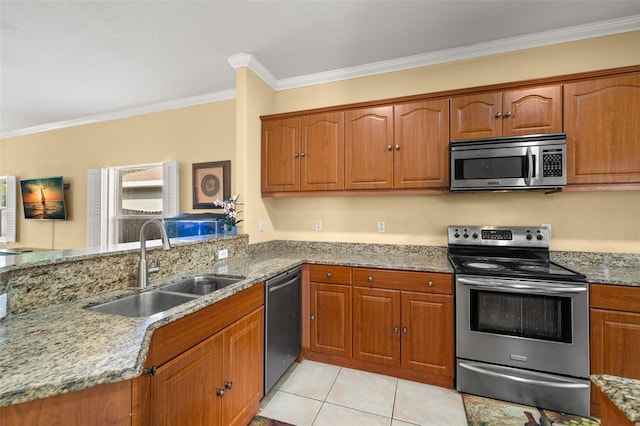 kitchen with sink, stainless steel appliances, light stone counters, crown molding, and light tile patterned floors