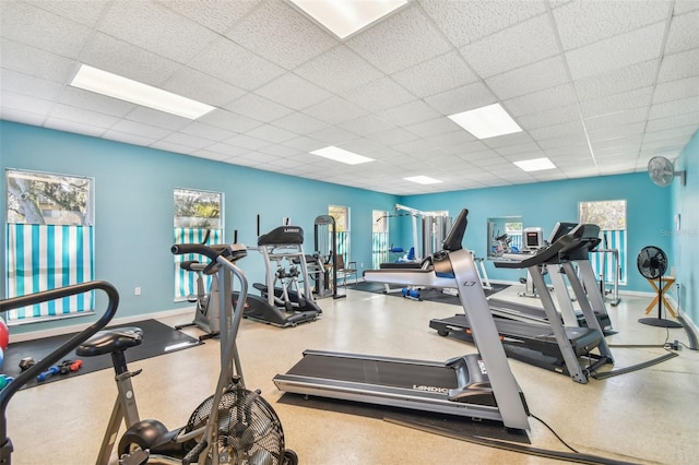 exercise room featuring a paneled ceiling