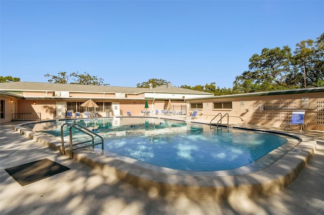 view of pool featuring a patio