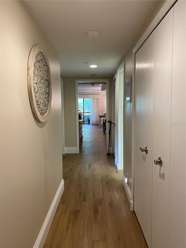 hallway featuring hardwood / wood-style flooring