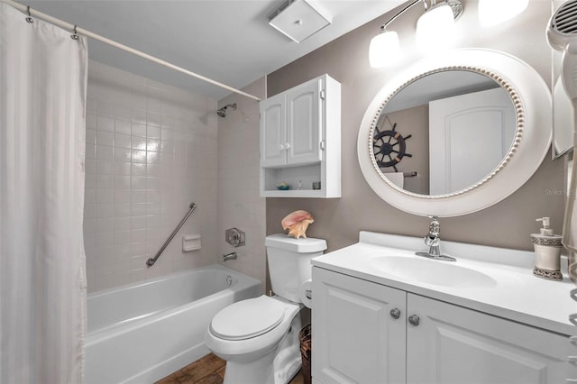 full bathroom with vanity, shower / bath combo, and toilet