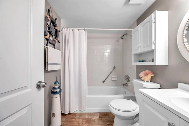 full bathroom with shower / tub combo with curtain, vanity, and toilet