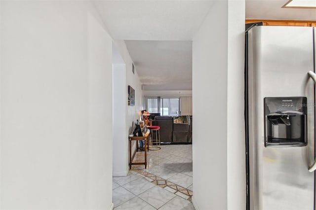 corridor with light tile flooring