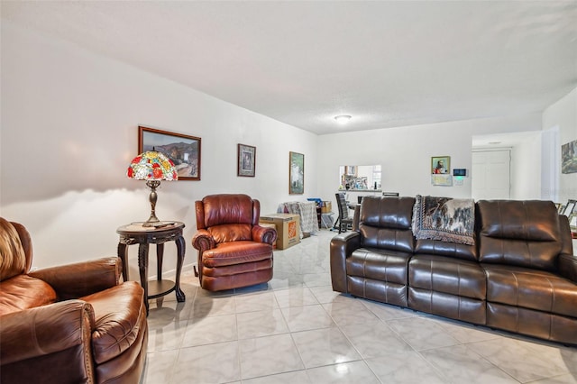 living room featuring light tile floors