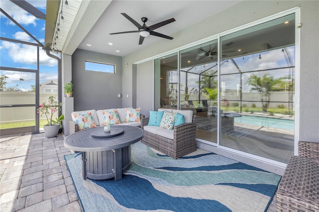 view of patio with glass enclosure, a fenced in pool, an outdoor living space, and ceiling fan