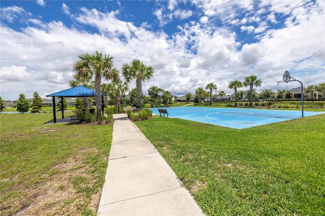 view of sport court with a lawn and a gazebo