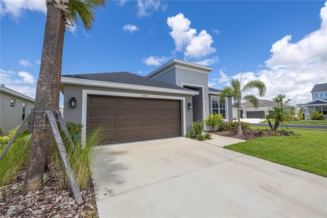 view of front facade featuring a garage and a front yard