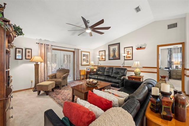 living room with ceiling fan, lofted ceiling, light carpet, and french doors