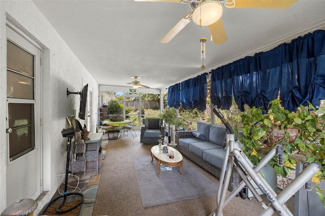 sunroom / solarium featuring ceiling fan