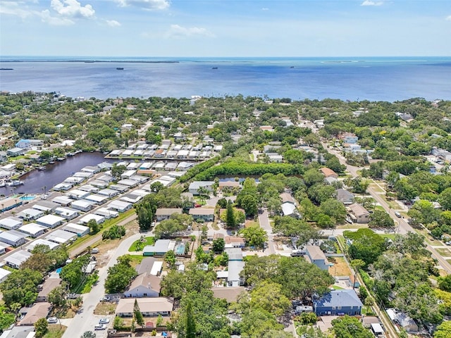 birds eye view of property with a water view and a residential view