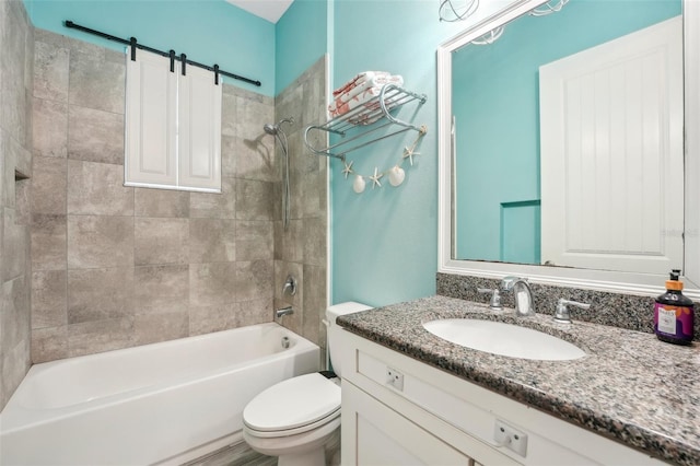 bathroom with shower / bathing tub combination, vanity, and toilet