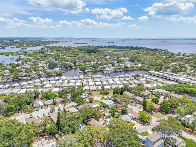 drone / aerial view featuring a residential view and a water view