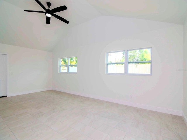 tiled empty room featuring lofted ceiling, a wealth of natural light, and ceiling fan