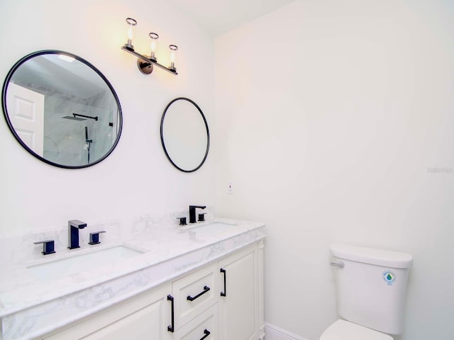 bathroom with vanity, toilet, and walk in shower