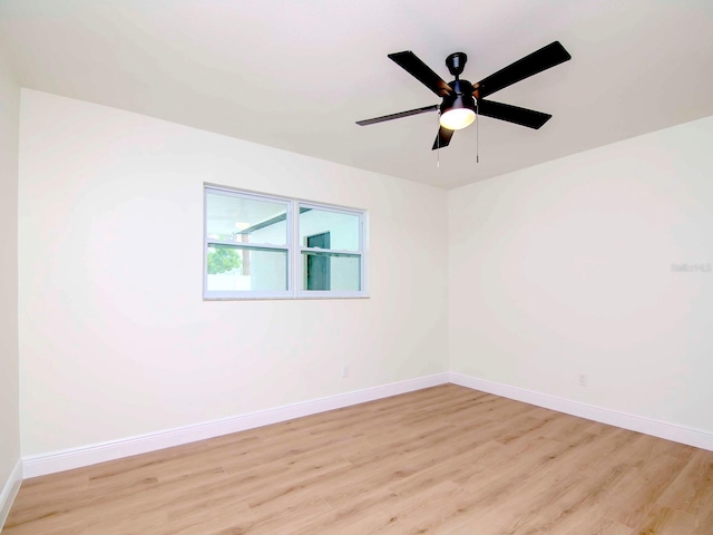 spare room featuring ceiling fan and light hardwood / wood-style floors