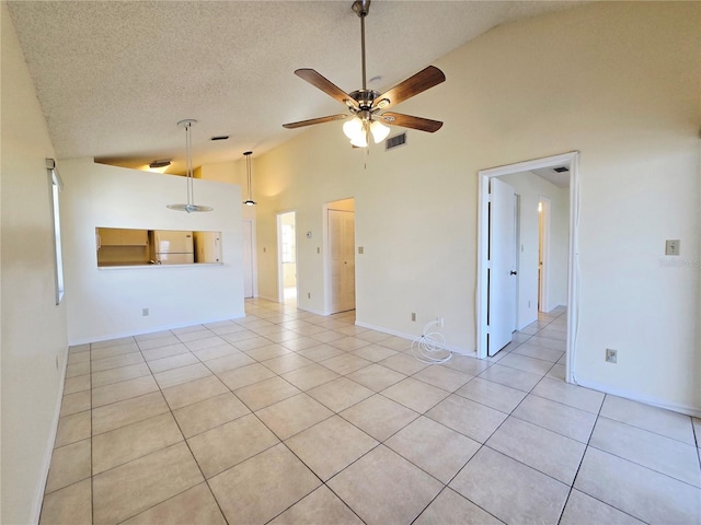 6802 Stones Throw Cir N Unit 14206, Saint Petersburg, FL 33710 - unfurnished living room with ceiling fan, light tile patterned flooring, high vaulted ceiling, a textured ceiling, and baseboards