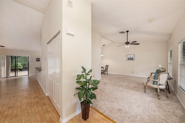 interior space with hardwood / wood-style flooring and lofted ceiling