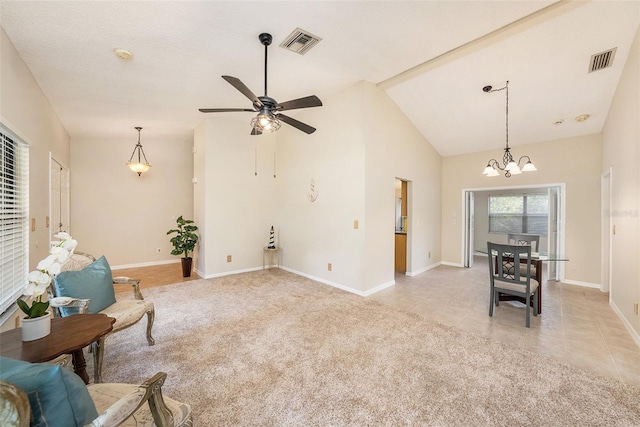 living area featuring light carpet, visible vents, and light tile patterned flooring