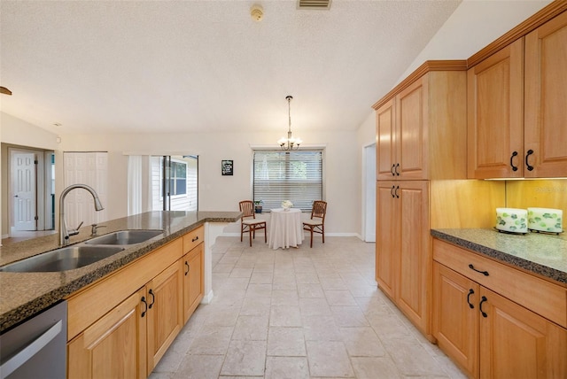 kitchen featuring baseboards, a sink, a notable chandelier, a textured ceiling, and stainless steel dishwasher