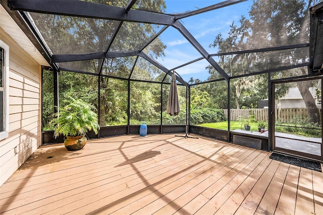 unfurnished sunroom with vaulted ceiling