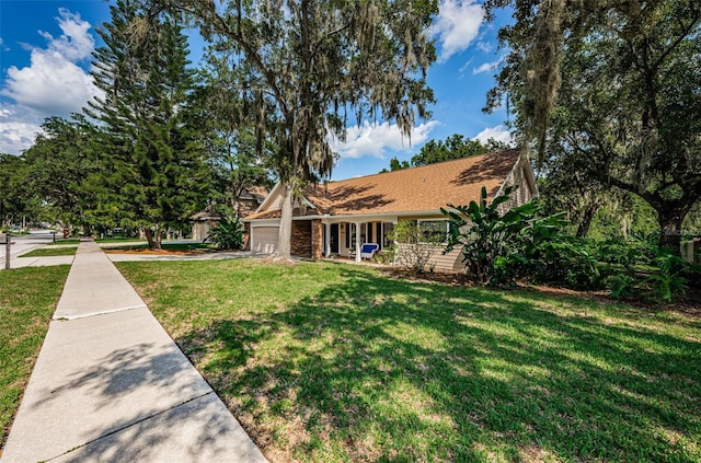 view of front facade with a garage and a front lawn