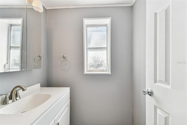 bathroom featuring vanity and ornamental molding