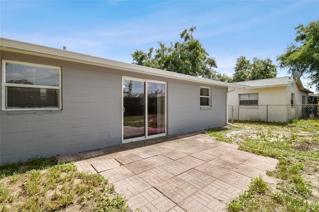 rear view of property featuring a patio area