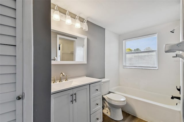 full bathroom with wood-type flooring, vanity, toilet, and shower / bathtub combination