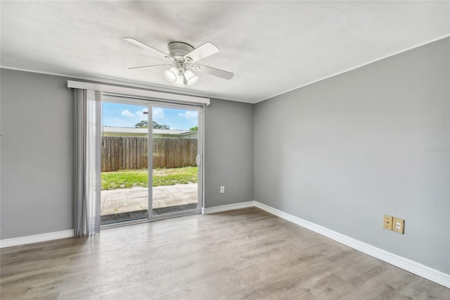 unfurnished room featuring hardwood / wood-style flooring and ceiling fan