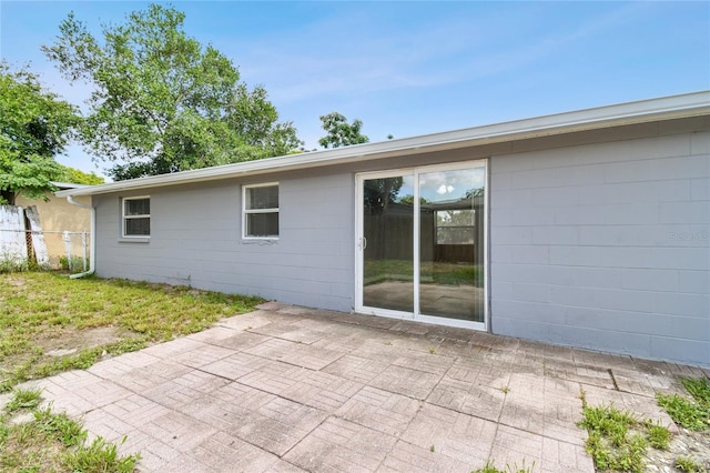 back of property featuring a patio area