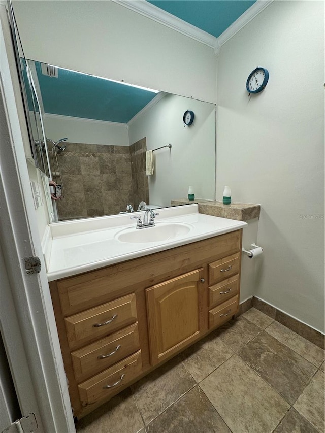 bathroom with crown molding and vanity