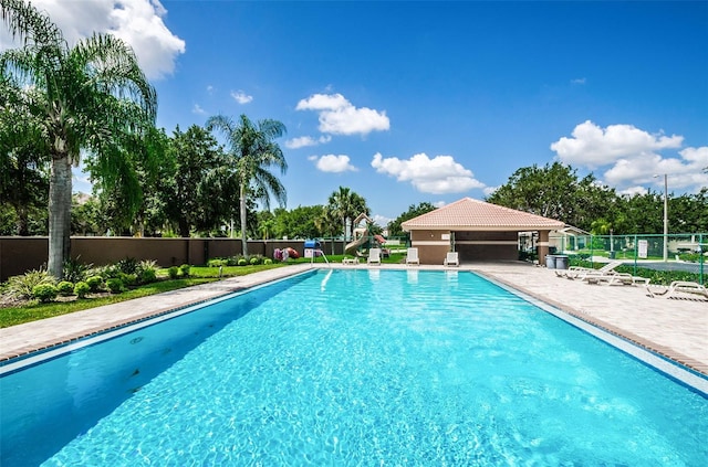 view of swimming pool with a patio