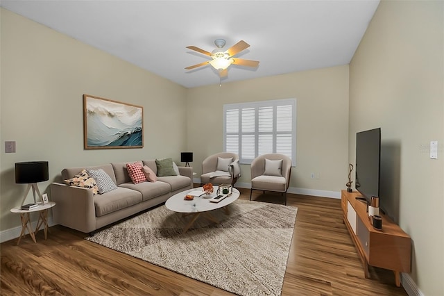 living room with ceiling fan and hardwood / wood-style flooring