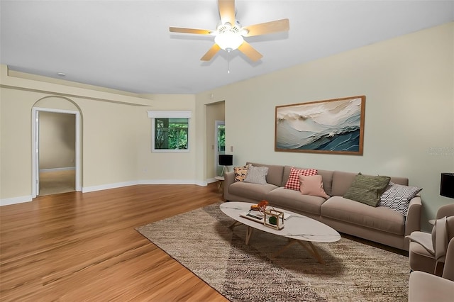 living room featuring hardwood / wood-style flooring and ceiling fan