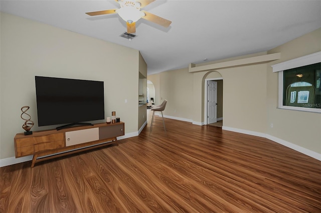 unfurnished living room with ceiling fan and wood-type flooring