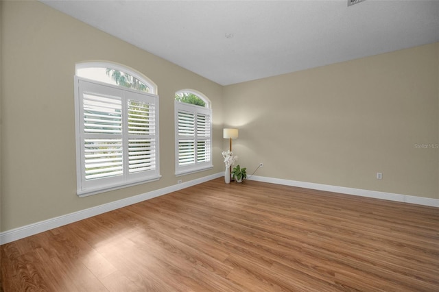 spare room featuring light wood-type flooring