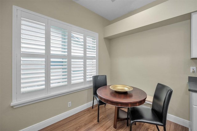 dining space with light hardwood / wood-style floors