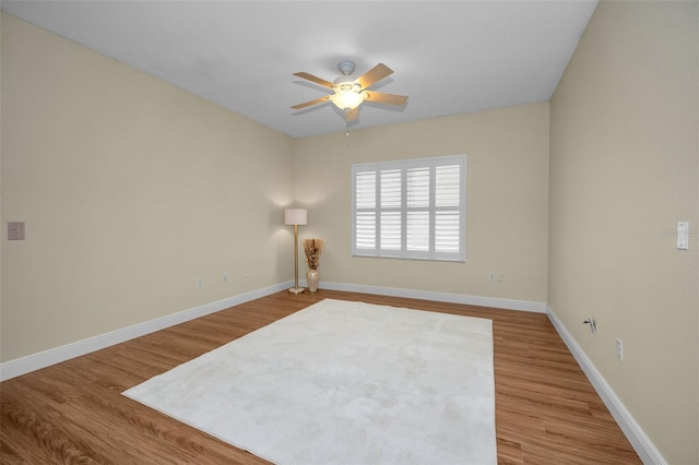 unfurnished room with hardwood / wood-style flooring and ceiling fan