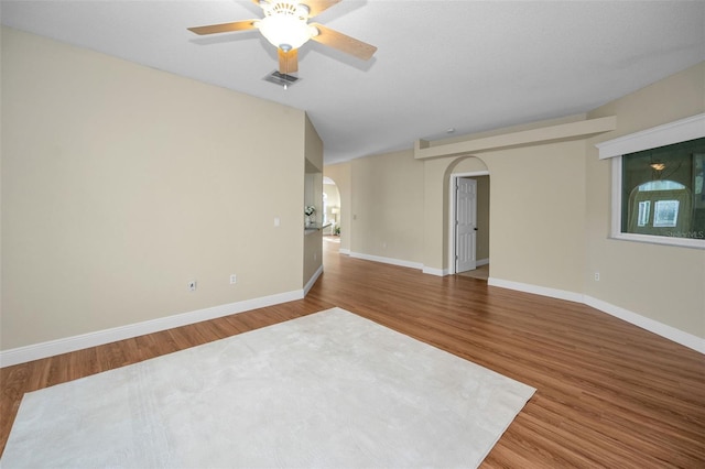 spare room with wood-type flooring and ceiling fan