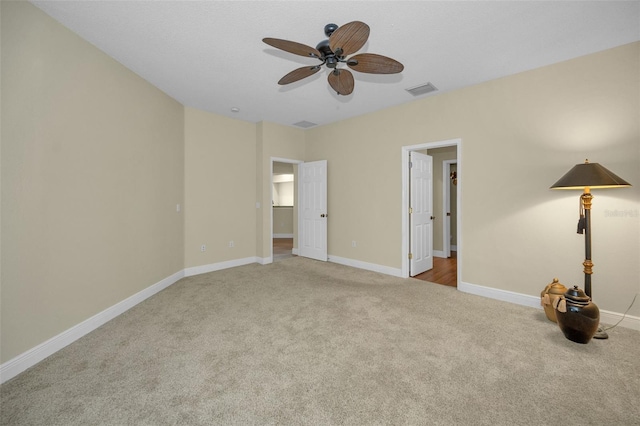 unfurnished bedroom featuring ceiling fan and light colored carpet