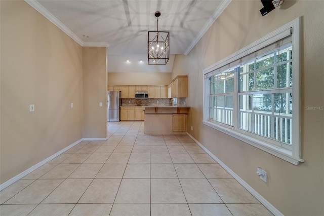 kitchen with hanging light fixtures, tasteful backsplash, light brown cabinetry, light tile patterned flooring, and appliances with stainless steel finishes