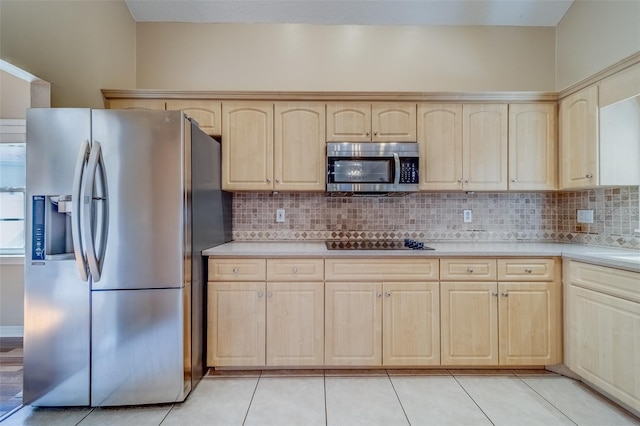 kitchen with decorative backsplash, light brown cabinetry, stainless steel appliances, and light tile patterned floors