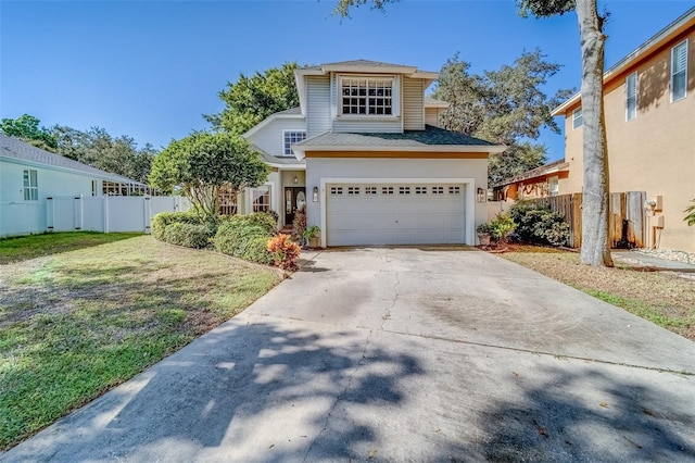 view of front of property featuring a garage and a front yard