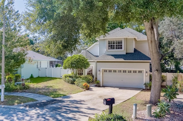 front of property featuring a garage and a front lawn