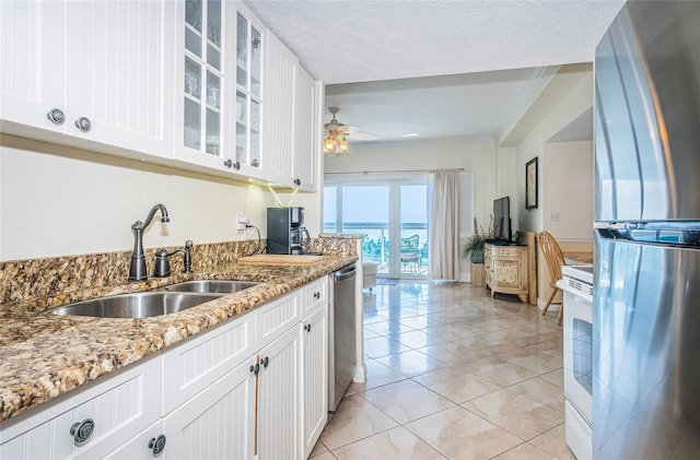 kitchen featuring white cabinetry, appliances with stainless steel finishes, and sink