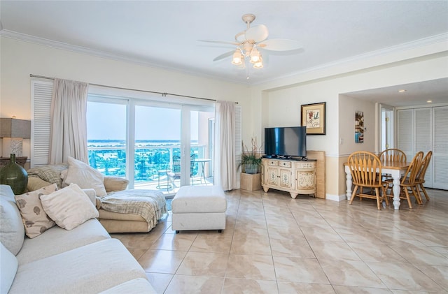 living room with crown molding, ceiling fan, and light tile patterned flooring